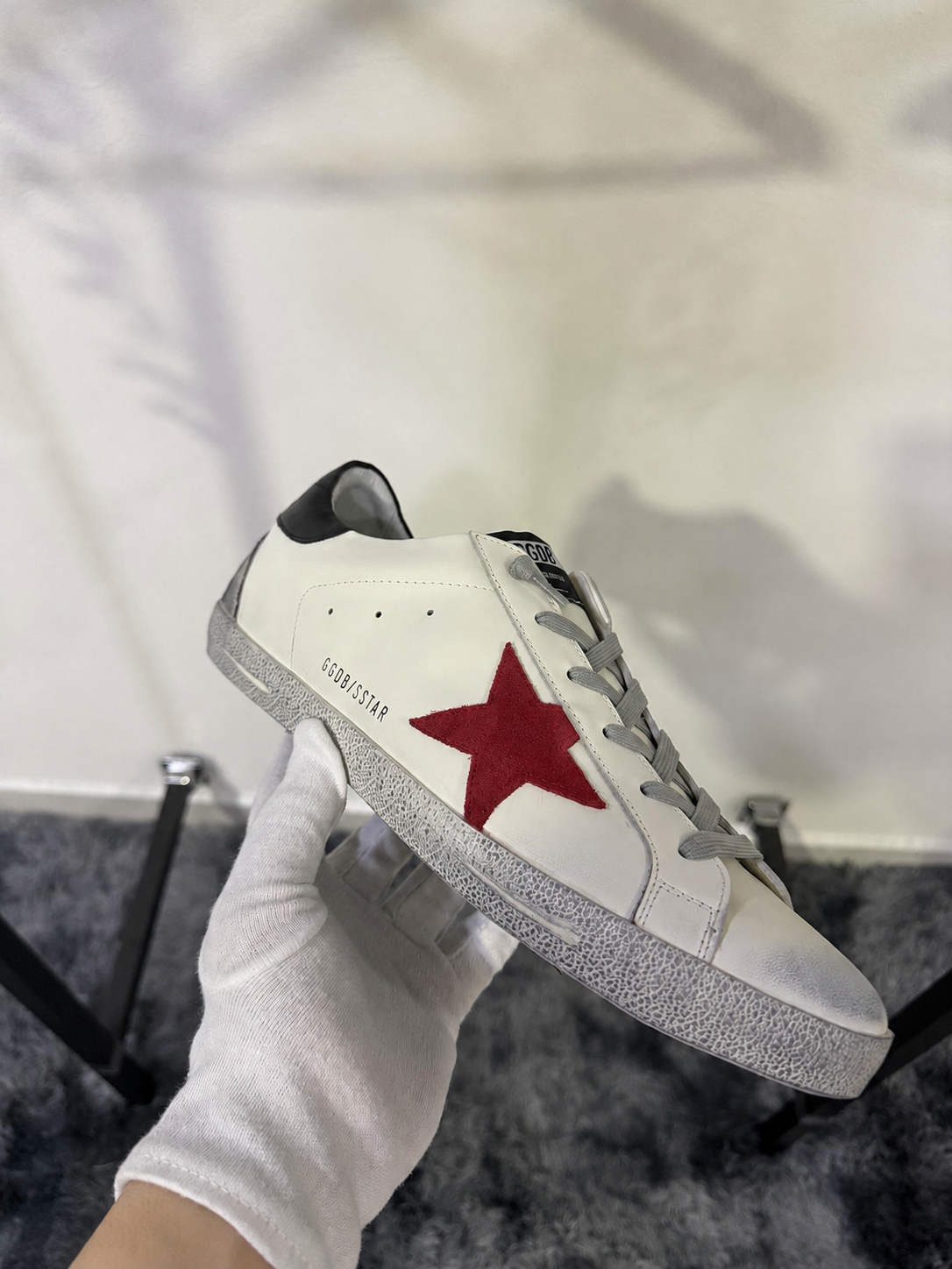 Golden Goose Super-Star con stella in suede rosso e talloncino in pelle verde