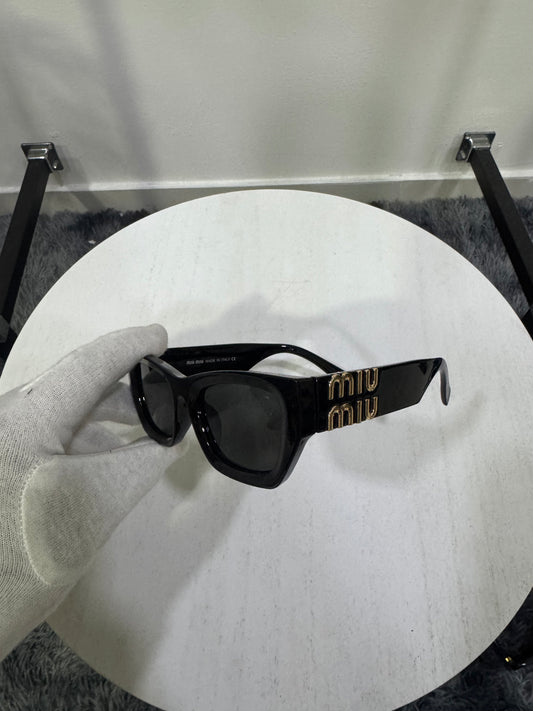 Occhiali da sole Miu Miu MU 09WS (1AB5S0)